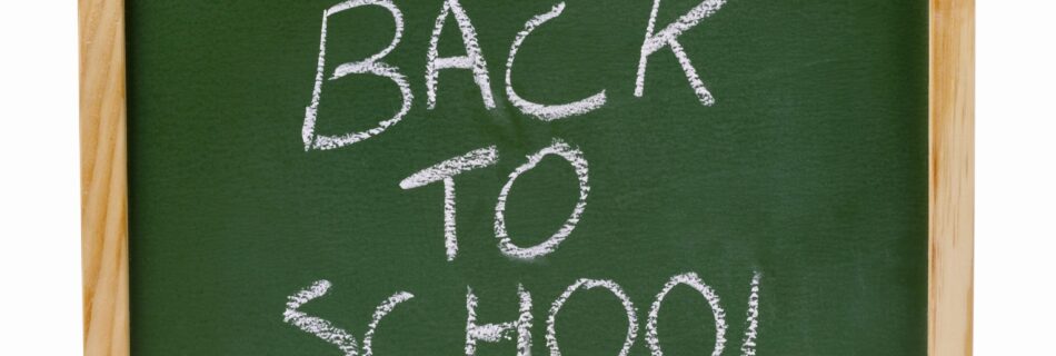 Close up of a chalkboard with back to school written on it